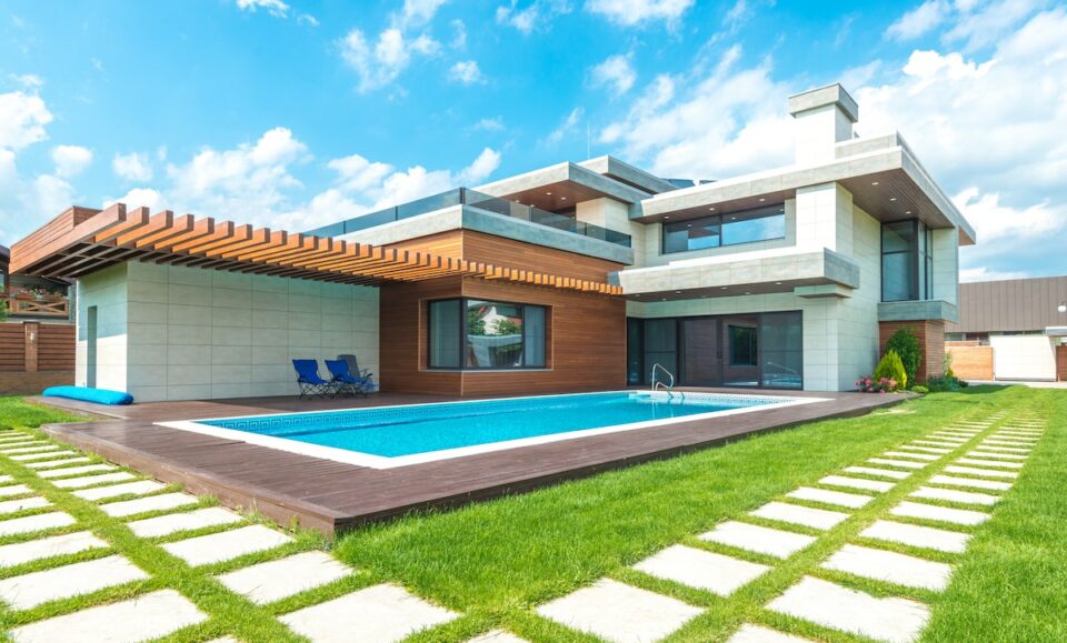 A Modern House with Swimming Pool Under the Blue Sky